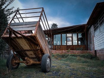 Abandoned truck on field against sky