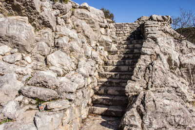 Low angle view of man on rock formation