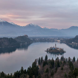 Scenic view of lake and mountains against sky