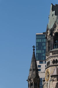 Low angle view of building against clear blue sky