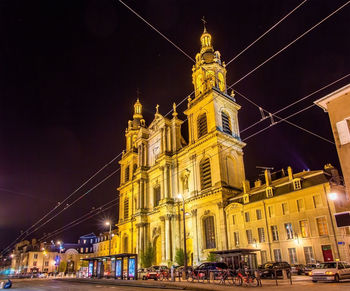 Low angle view of illuminated buildings at night