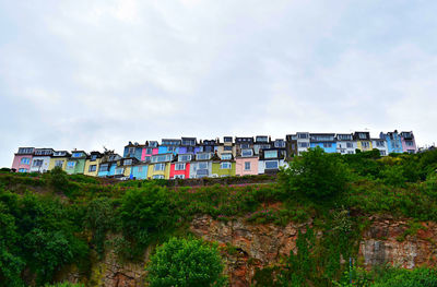 Low angle view of houses on cliff