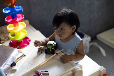 Close-up of boy playing with toy