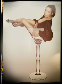 Portrait of young woman looking at camera