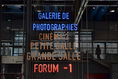 Information sign on illuminated city at night