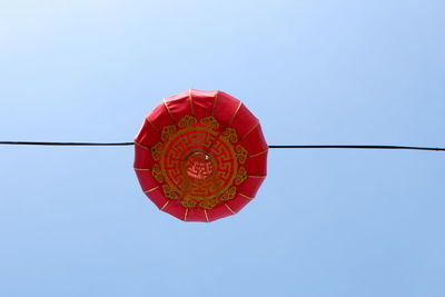 Low angle view of lantern against sky