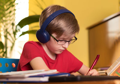 Boy sitting on table