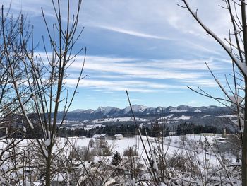 Scenic view of frozen lake against sky during winter