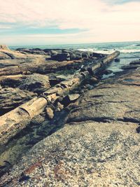 Scenic view of sea against cloudy sky