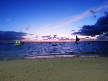Scenic view of sea against cloudy sky