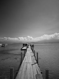 Pier over sea against sky