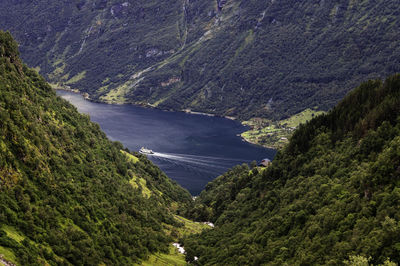 Looking down at a ferry on the geirangerfjord in norway.