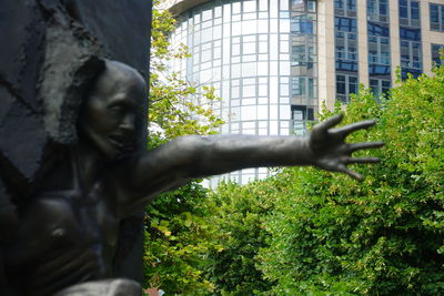 Low angle view of statue against building