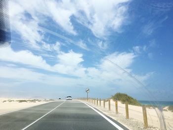 Empty road against sky