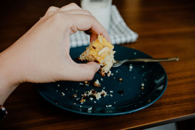 Cropped hand of person preparing food