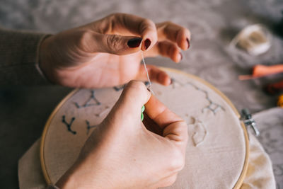 High angle view of person hand holding paper