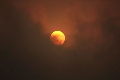 Scenic view of moon against sky at sunset