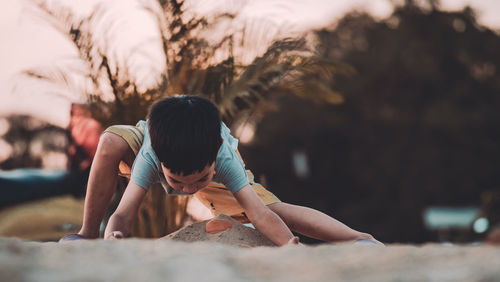 Woman sitting on rock