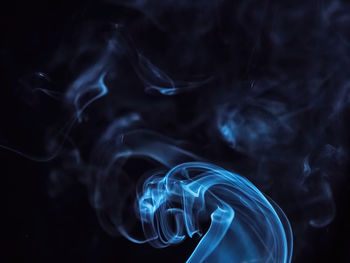 Close-up of smoke against black background