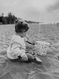 Portrait of boy sitting on beach