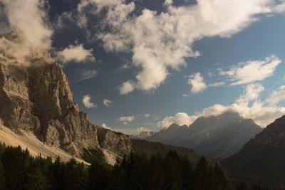 Scenic view of mountains against cloudy sky