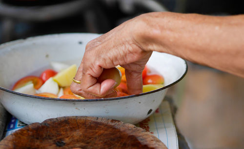 Close-up of person preparing food