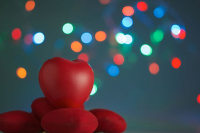 Close-up of heart shapes against defocused multi colored lights