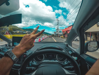 Man driving car in summer time