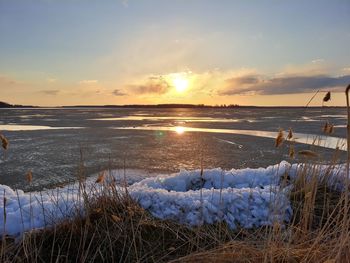 Scenic view of sea against sky during sunset