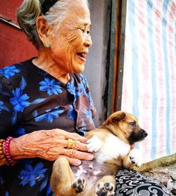 Woman holding dog