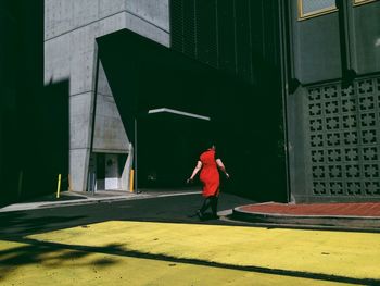 Full length of woman standing by railing