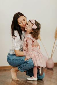 Portrait of a mother and her daughter, they smile and hug. family vacation and unity