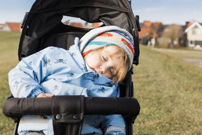 Cute baby girl sleeping in stroller