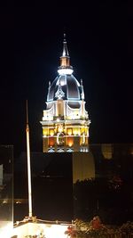 Illuminated cathedral against sky at night