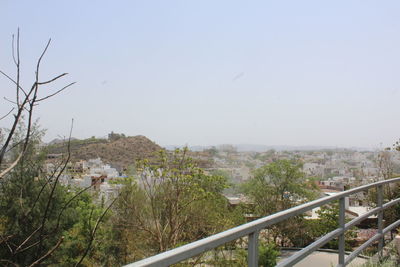 Scenic view of town against clear sky