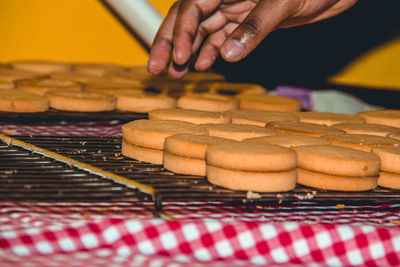 Close-up of person preparing food on table