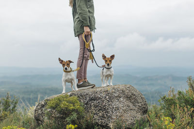 Woman walking with her two dogs