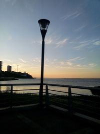 Scenic view of sea against sky at sunset