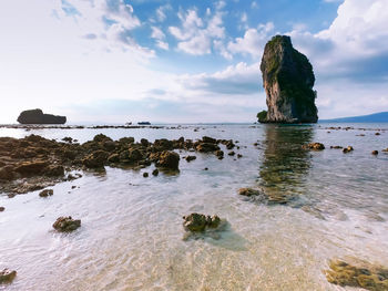 Rocks on shore against sky