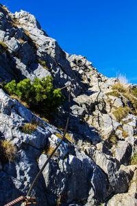 Scenic view of mountains against clear blue sky