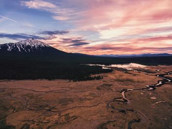 Scenic view of landscape against sky during sunset