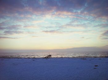 Scenic view of sea against sky at sunset