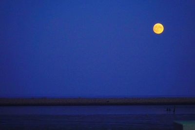 Scenic view of sea against blue sky