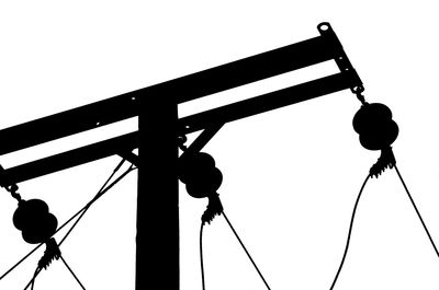 Low angle view of power lines against sky