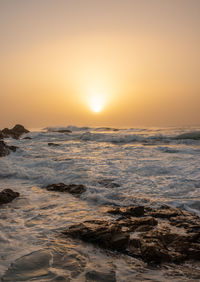 Scenic view of sea against sky during sunset