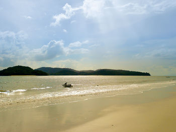 Scenic view of beach against sky