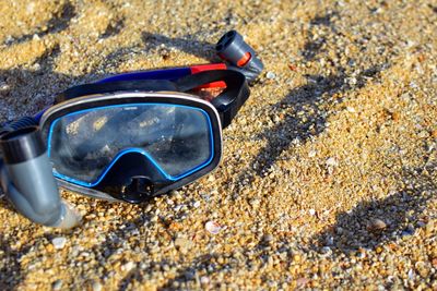 High angle view of sunglasses on rock