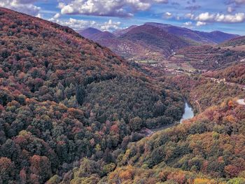 High angle view of trees and mountains against sky
