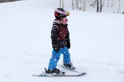 Full length of child in snow on land