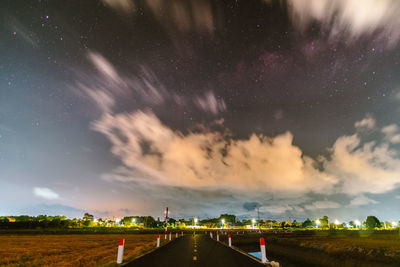 Scenic view of field against sky at night
